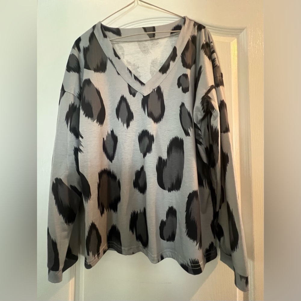 Animal print top.  V Neck. Black Gray. Size small.
